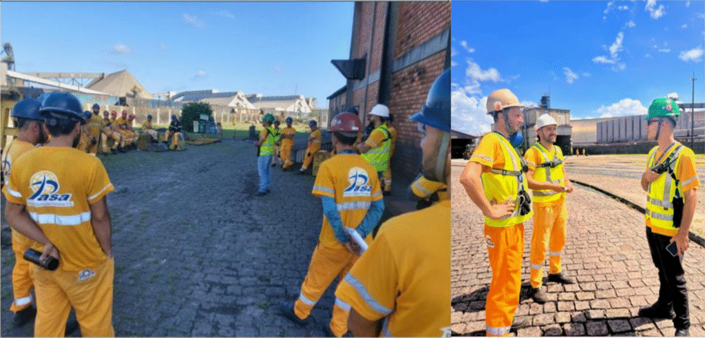 Colaboradores da PASA em treinamento prático no pátio do terminal, usando equipamento de proteção